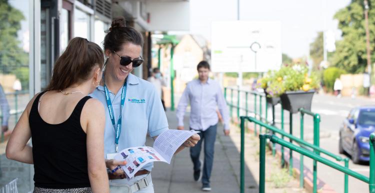 Two people looking at survey